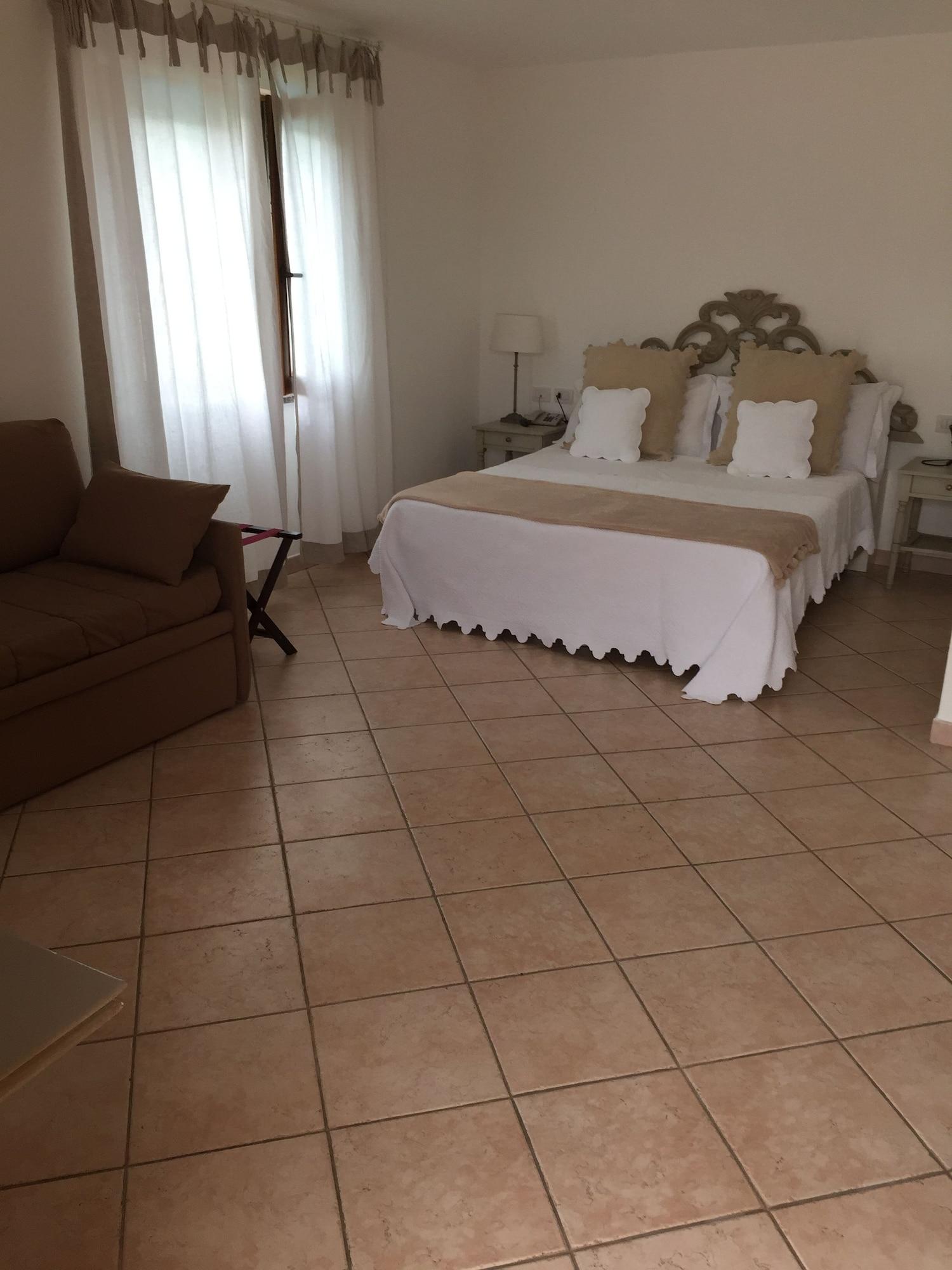 Relais Fenicottero Rosa Pensionat Porto Taverna Eksteriør billede