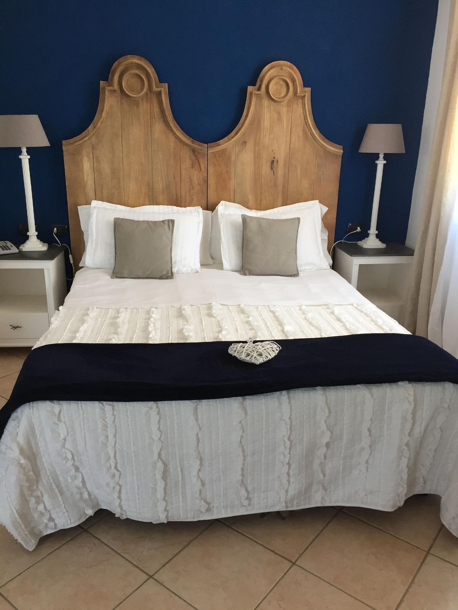 Relais Fenicottero Rosa Pensionat Porto Taverna Eksteriør billede