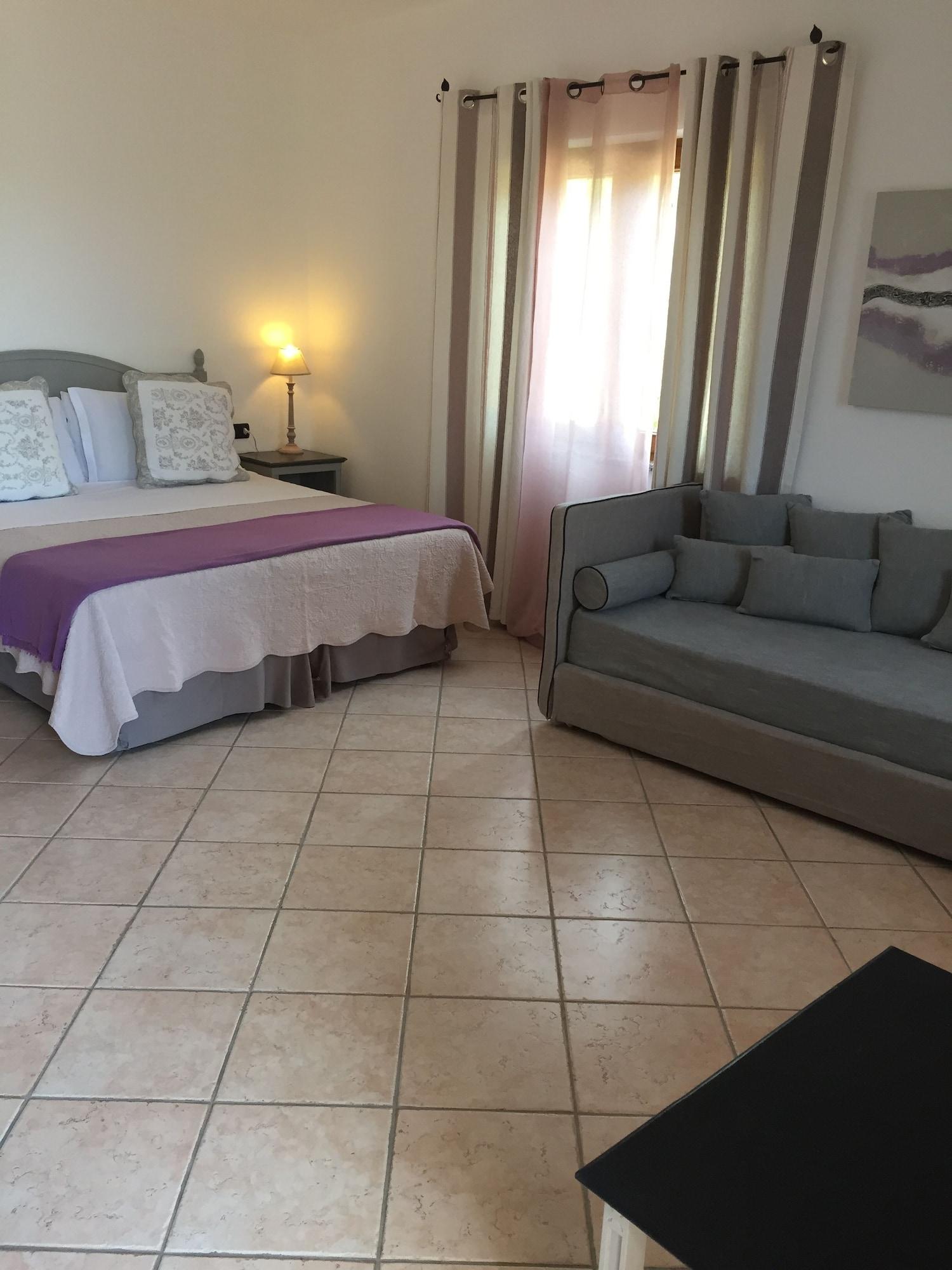 Relais Fenicottero Rosa Pensionat Porto Taverna Eksteriør billede