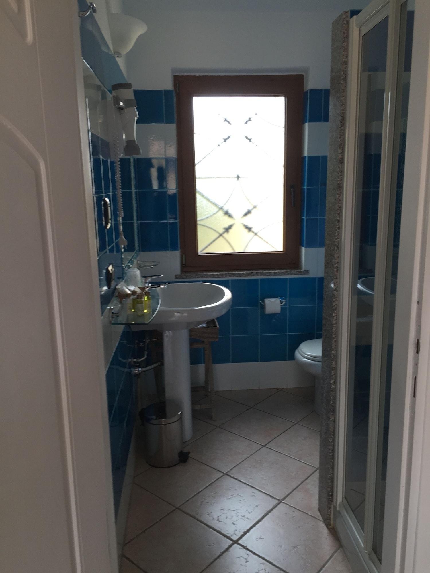 Relais Fenicottero Rosa Pensionat Porto Taverna Eksteriør billede