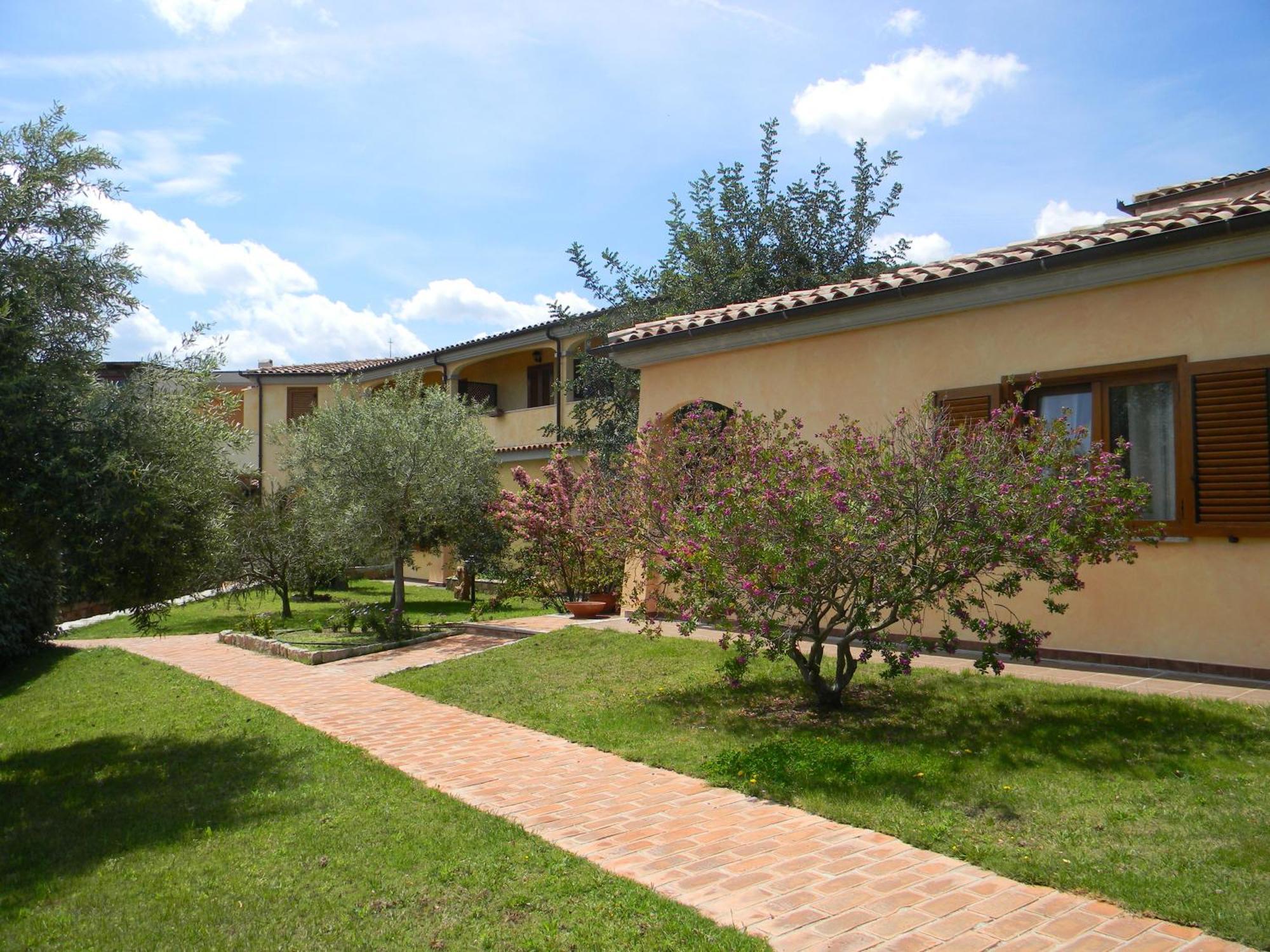 Relais Fenicottero Rosa Pensionat Porto Taverna Eksteriør billede